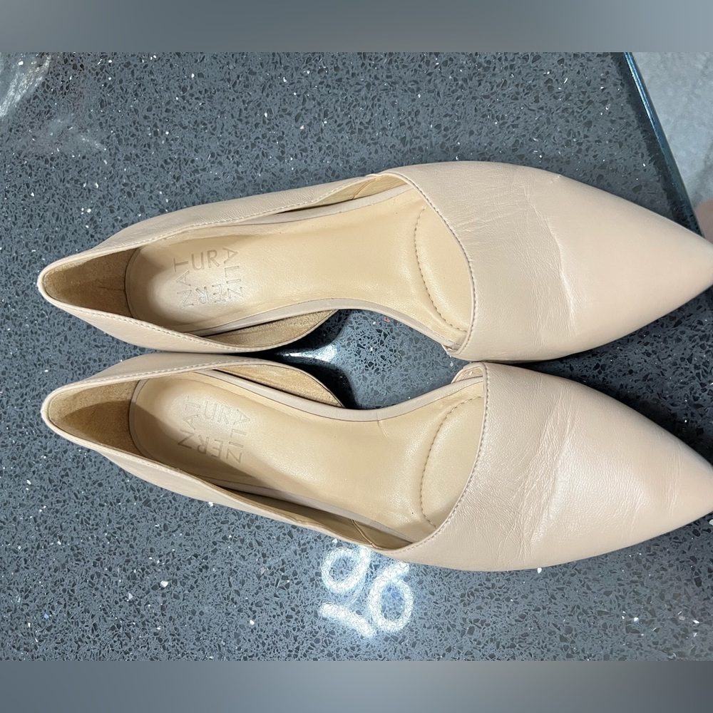 Naturalized cream colored flat dress shoes